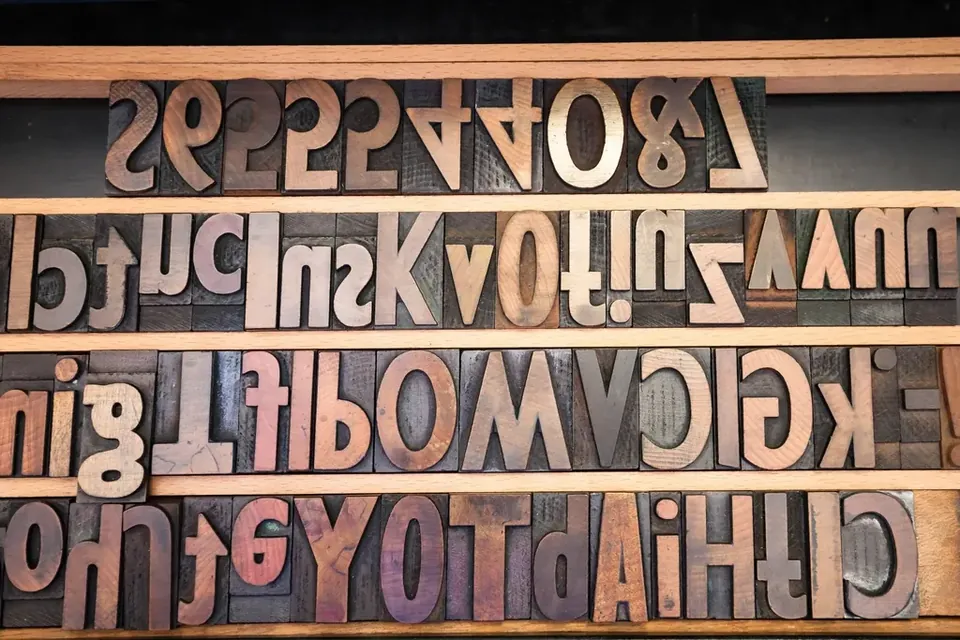 Rows of wooden printing letters stored in a type case