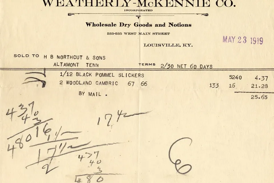 An old typed invoice with handwritten sums pencilled in the margin